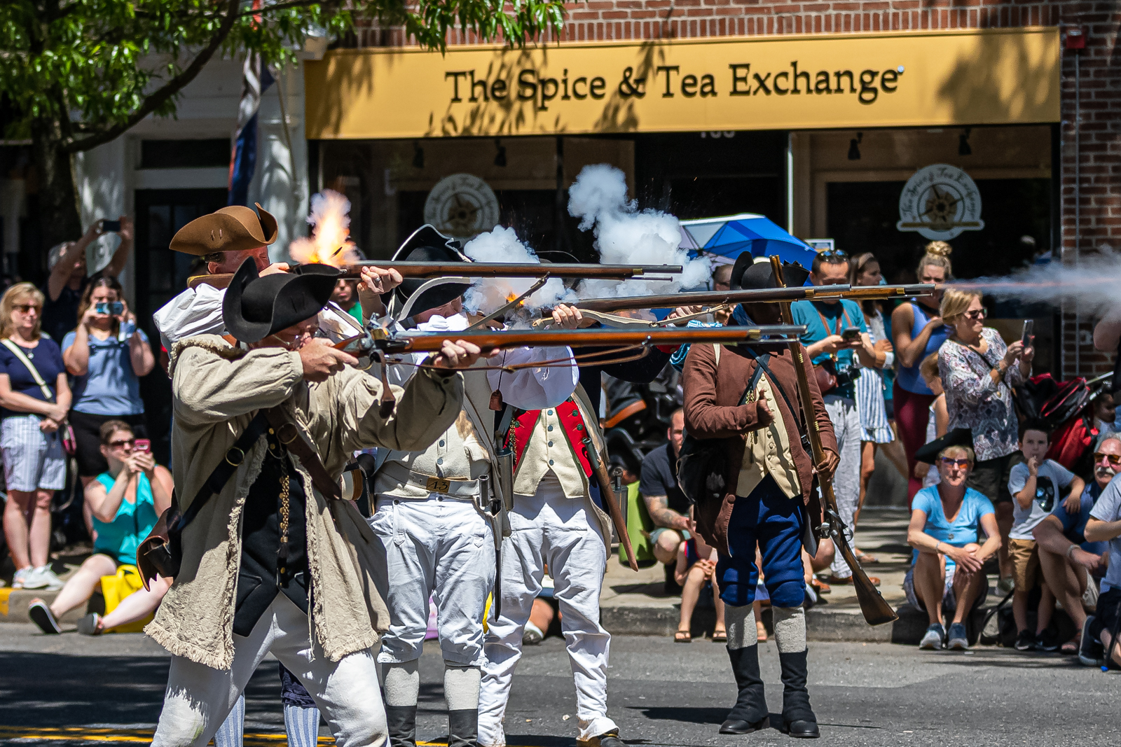 Muskets being fired outside the Tea Exchange